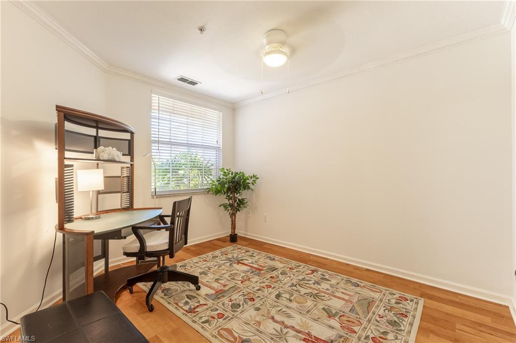 3975 Deer Crossing Court, Unit 102 Naples, FL 34114 - Photo 13 of 32 a workspace with furniture and a window