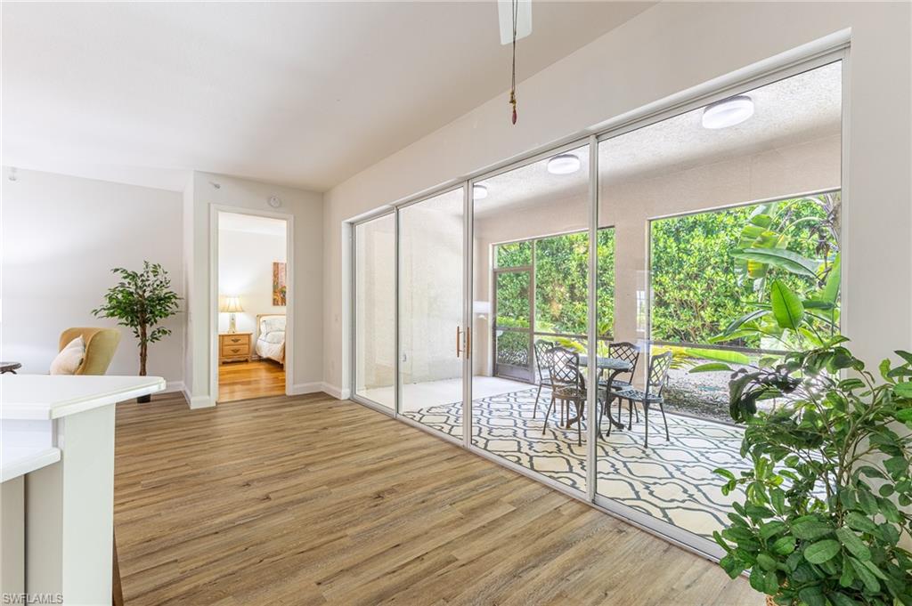 3975 Deer Crossing Court, Unit 102 Naples, FL 34114 - Photo 16 of 32 a view of a dining room with furniture window and outside view