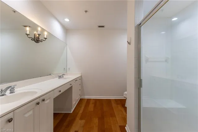 a spacious bathroom with a double vanity sink double and mirror