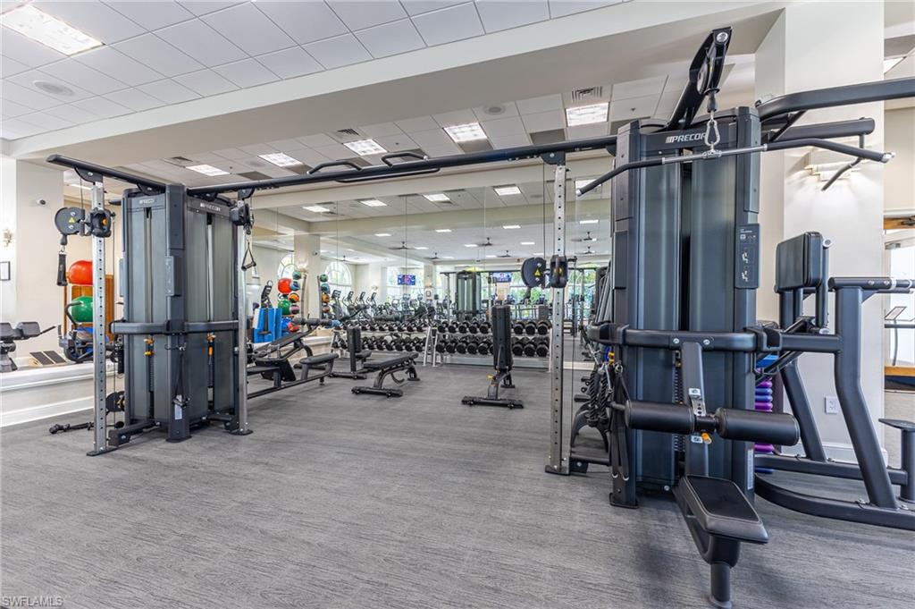 3975 Deer Crossing Court, Unit 102 Naples, FL 34114 - Photo 32 of 32 a view of a room with gym equipment