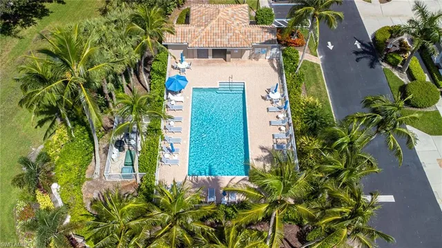 an aerial view of a house with a yard and garden