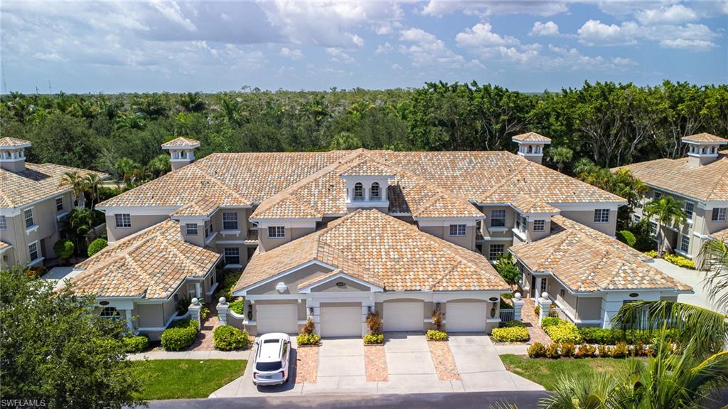 3975 Deer Crossing Court, Unit 102 Naples, FL 34114 - Photo 5 of 32 an aerial view of a house