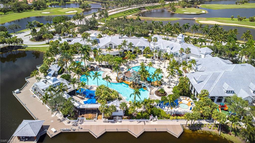 3975 Deer Crossing Court, Unit 102 Naples, FL 34114 - Photo 6 of 32 a view of a lake with a house
