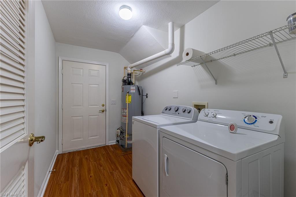 3975 Deer Crossing Court, Unit 102 Naples, FL 34114 - Photo 9 of 32 a view of a storage & utility room with a washer dryer