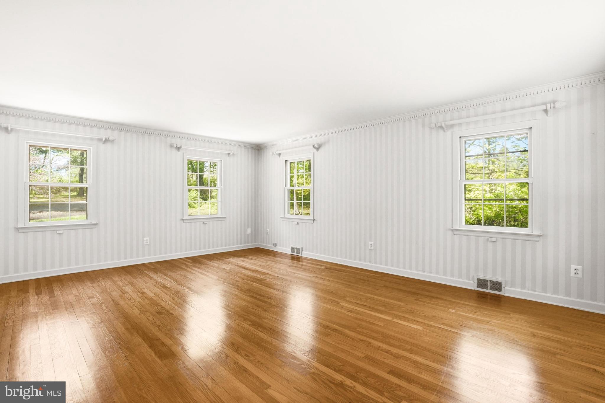 4511 Province Line Road Princeton, NJ 08540 - Photo 12 of 34 an empty room with wooden floor and windows