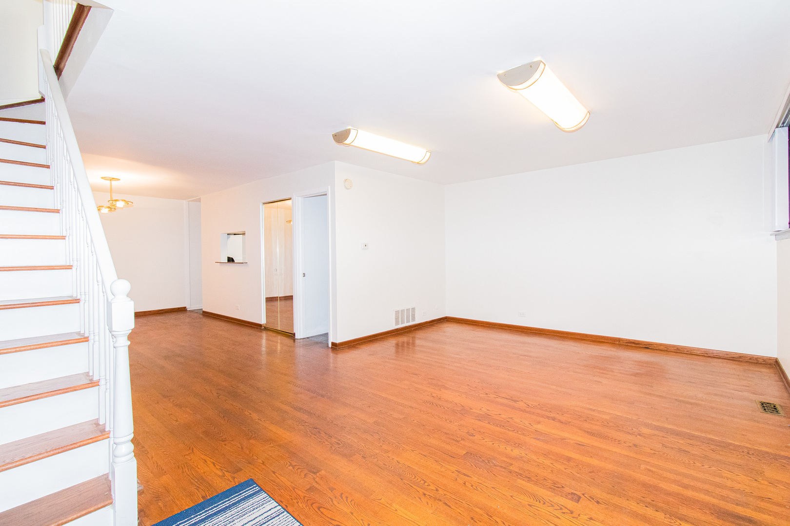 902 South May Street, Unit D Chicago, IL 60607 - Photo 5 of 24 a view of an empty room with wooden floor