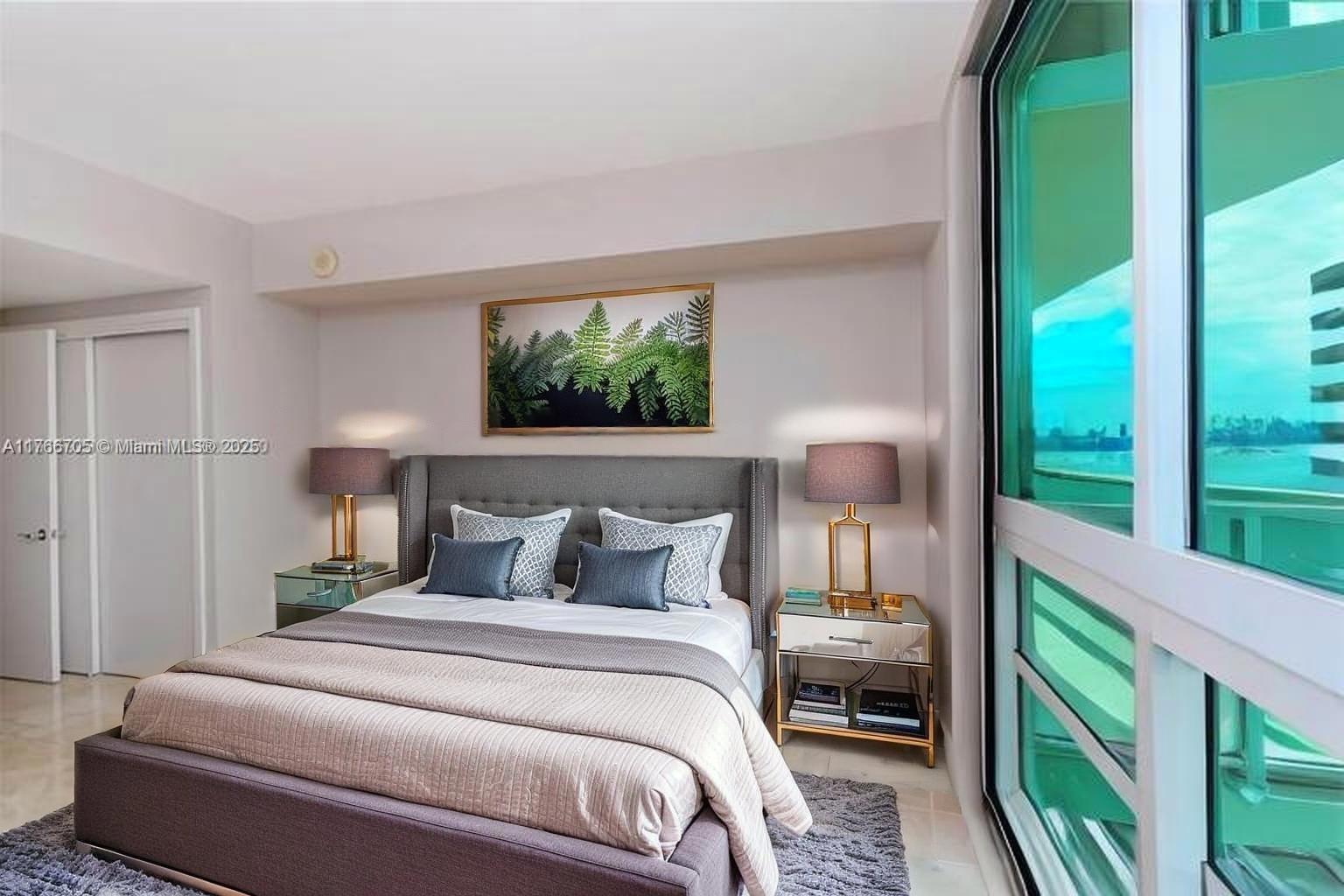 218 Southeast 14th Street, Unit 1203 Miami, FL 33131 - Photo 11 of 22 a bedroom with a bed and a window