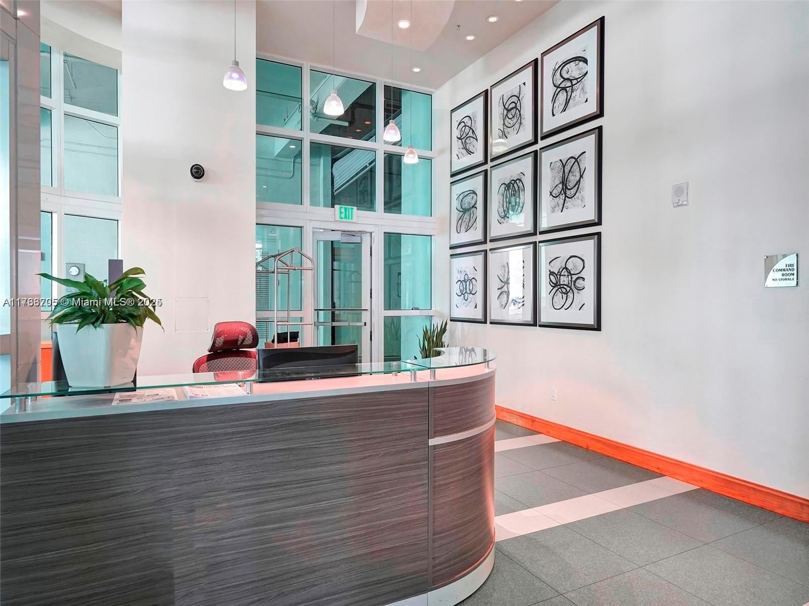 218 Southeast 14th Street, Unit 1203 Miami, FL 33131 - Photo 15 of 22 a view of living room filled with furniture window and wooden floor