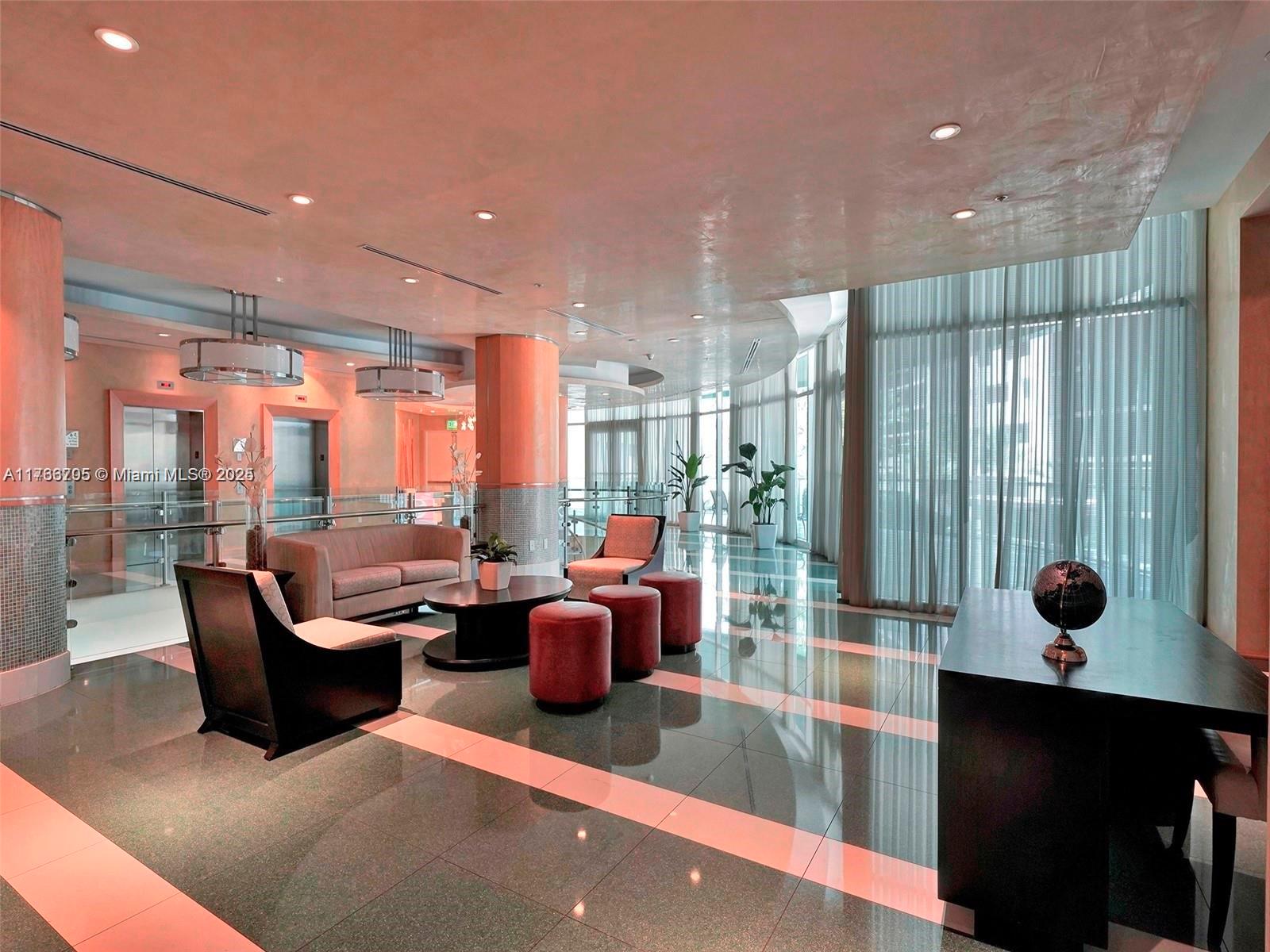 218 Southeast 14th Street, Unit 1203 Miami, FL 33131 - Photo 16 of 22 a living room with furniture and a potted plant