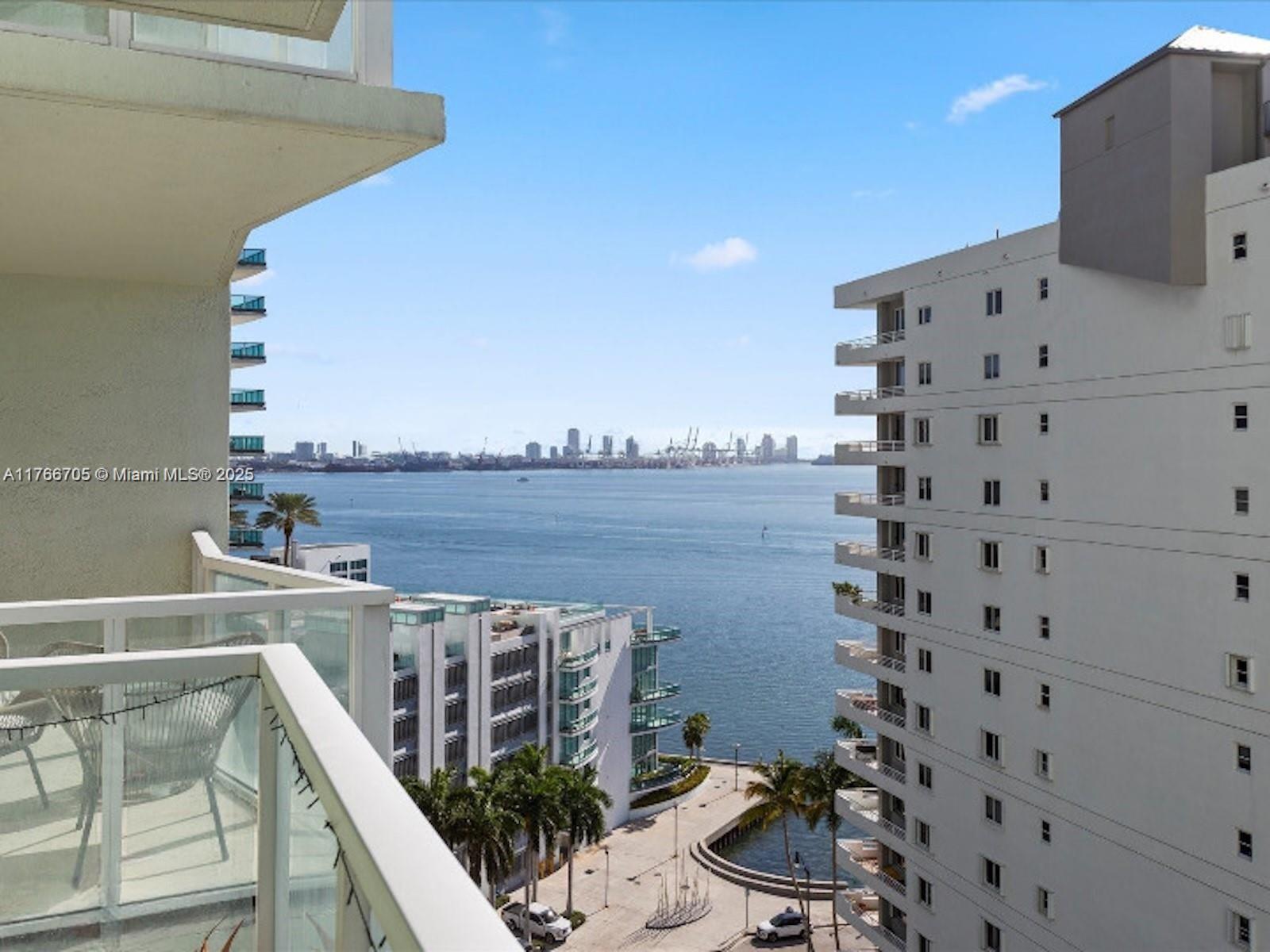 218 Southeast 14th Street, Unit 1203 Miami, FL 33131 - Photo 4 of 22 a view of a balcony with an ocean view