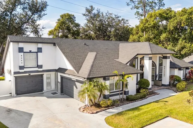 a view of a house with backyard tub and couches