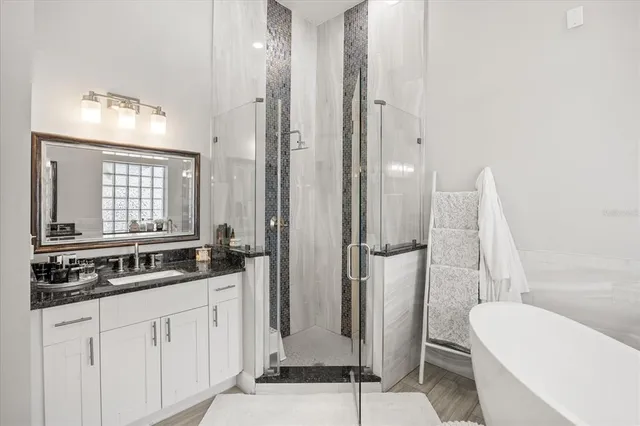 a bathroom with a double vanity sink and mirror