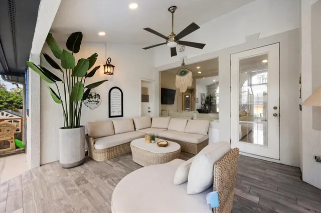 a living room with dining table a table and chairs