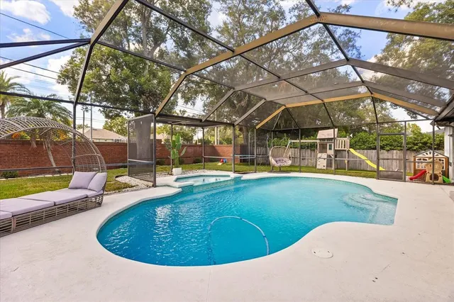 a view of a swimming pool with a yard