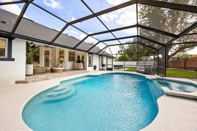 a view of a swimming pool with a patio
