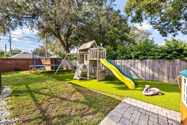 a view of a house with pool and a slide