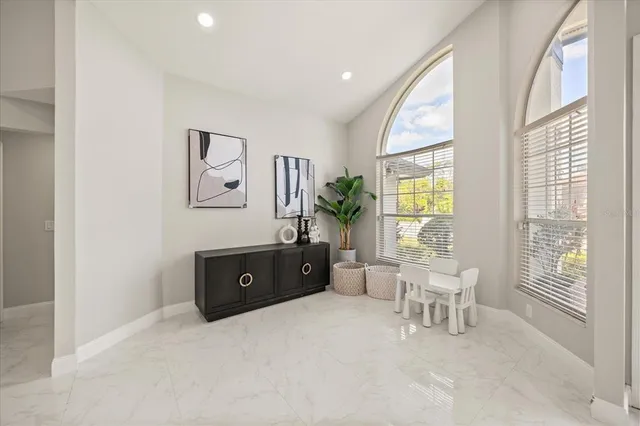 a living room with furniture and a window