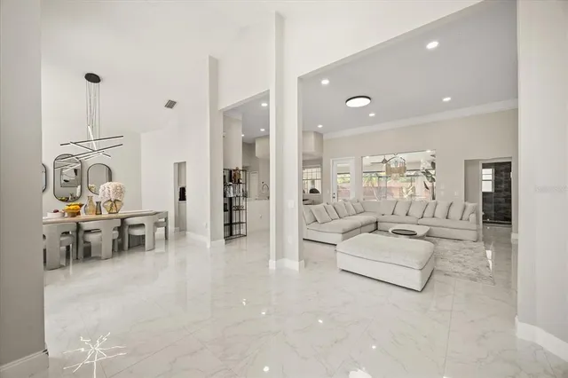 a lobby with furniture and view of living room