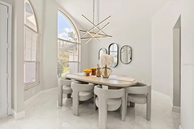 a dining room with furniture and window