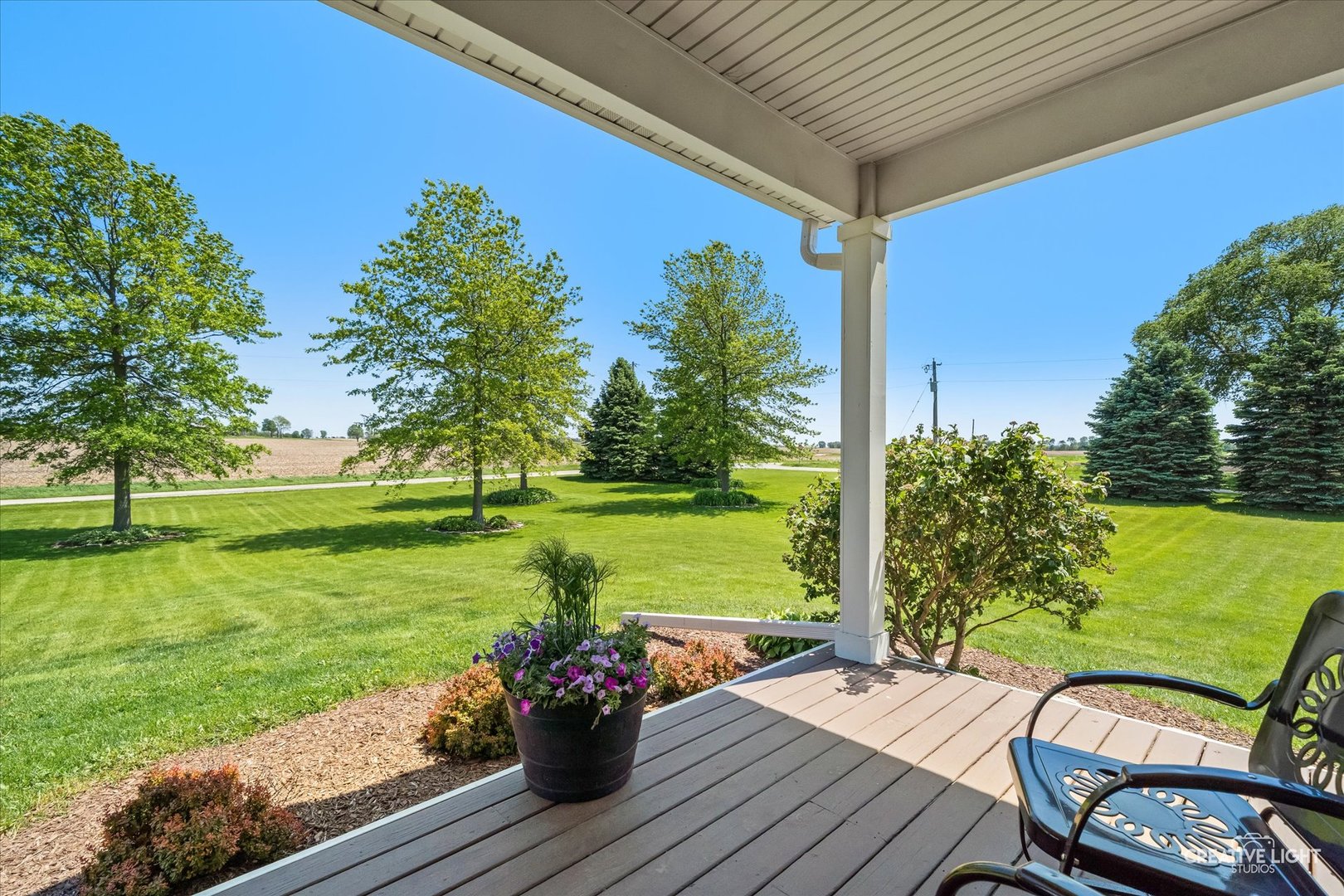 13495 Fennel Road Newark, IL 60541 - Photo 39 of 43 a view of a patio with wooden floor table and chairs