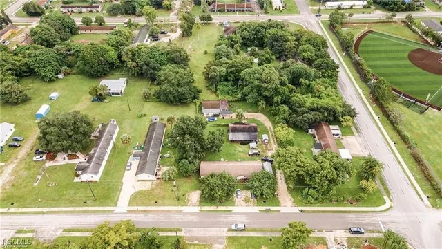 an aerial view of residential house with outdoor space and swimming pool