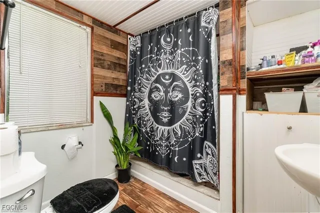 a bathroom with a bathtub and shower