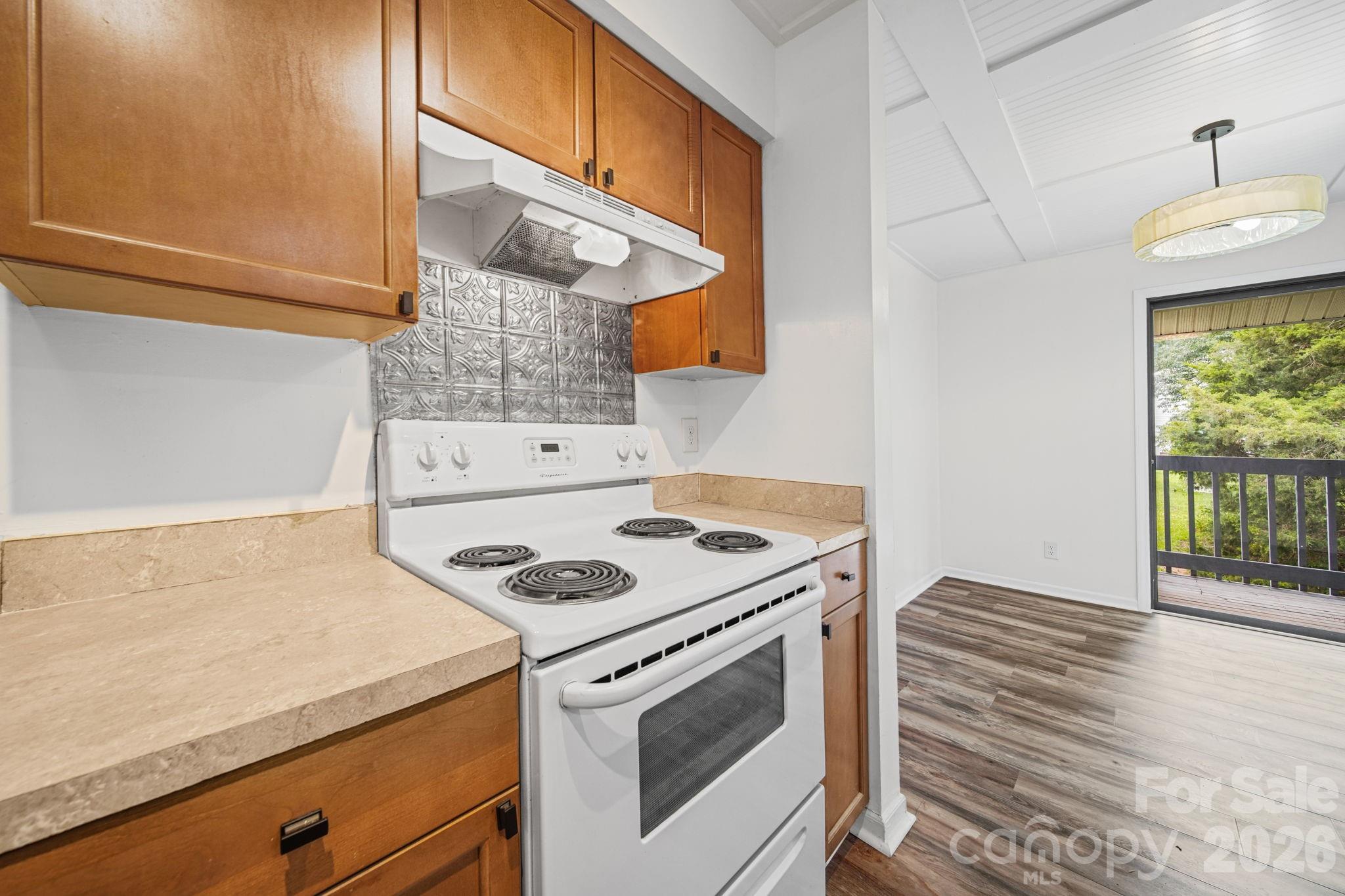 11023 Harrowfield Road Charlotte, NC 28226 - Photo 13 of 32 a kitchen that has a stove and a microwave
