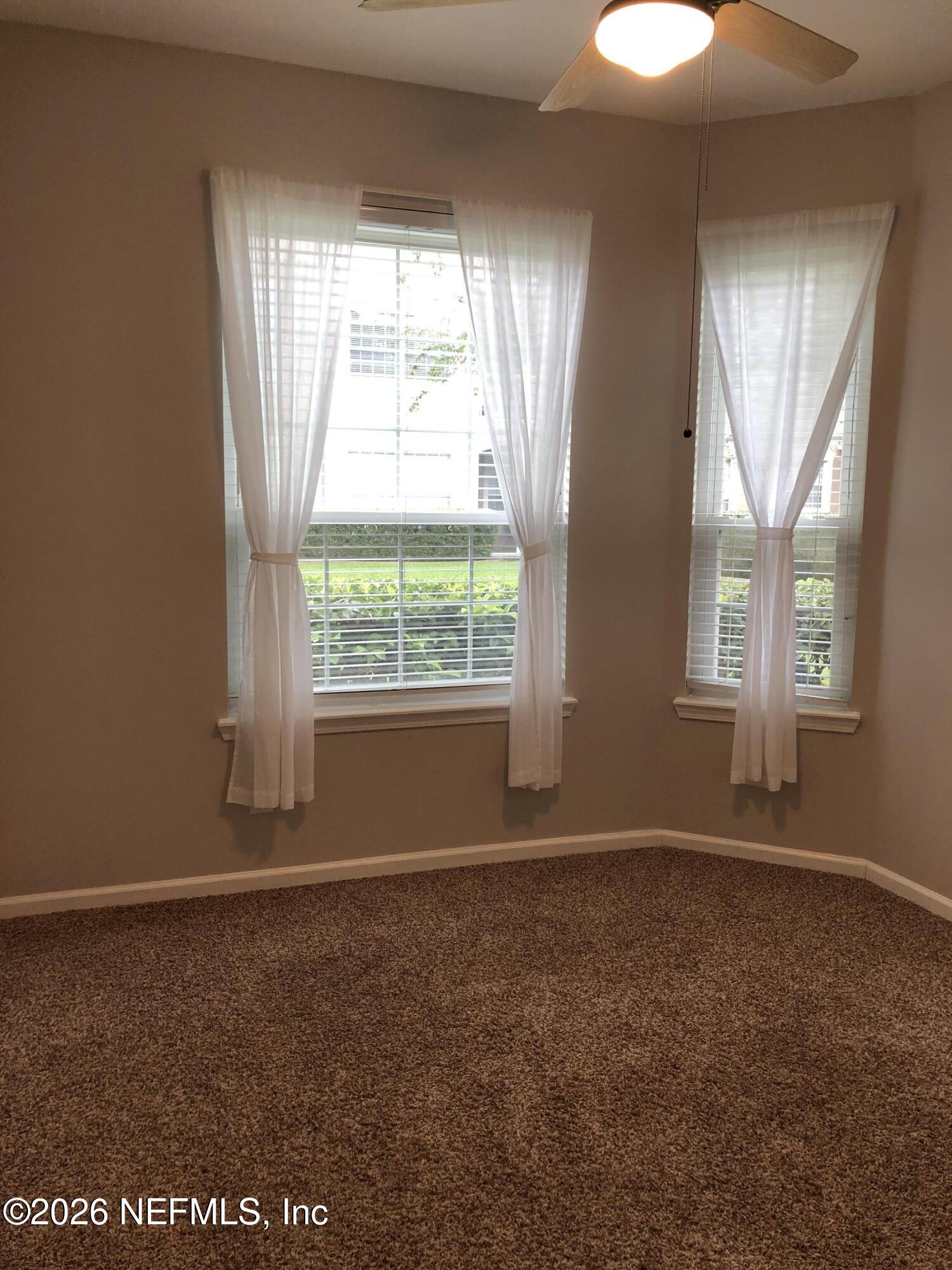 7990 Baymeadows Road, Unit 803 Jacksonville, FL 32256 - Photo 17 of 25 an empty room with windows
