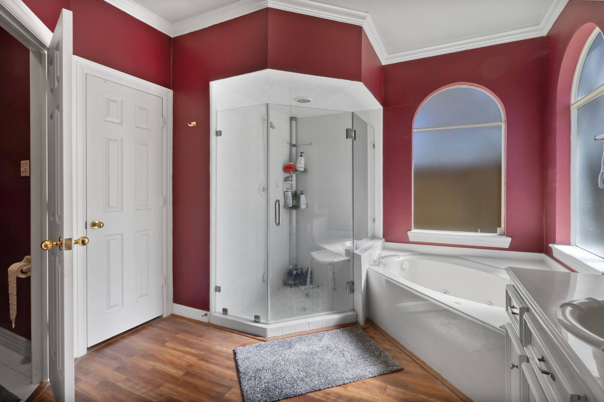 18106 Briden Oak Court Spring, TX 77379 - Photo 18 of 31 a bathroom with a tub a toilet and a sink