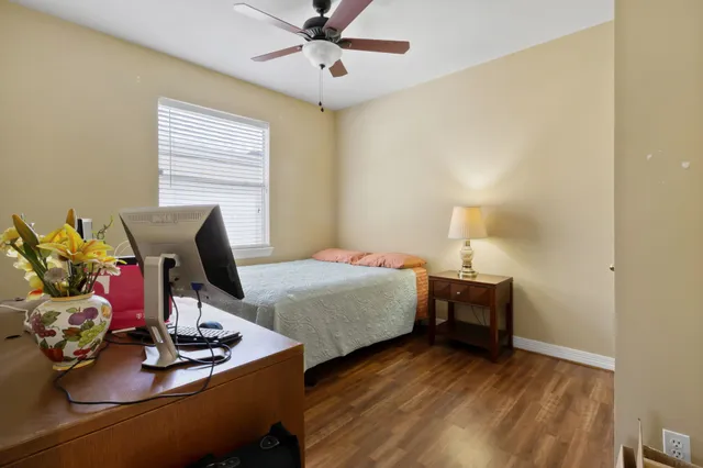 a bedroom with bed and a window