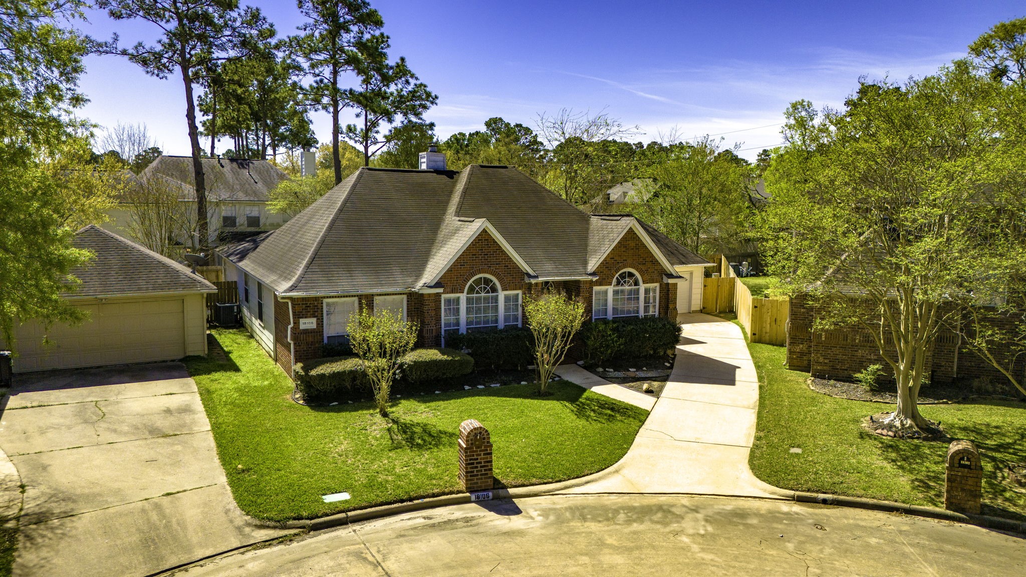 18106 Briden Oak Court Spring, TX 77379 - Photo 2 of 31 a view of a house with swimming pool