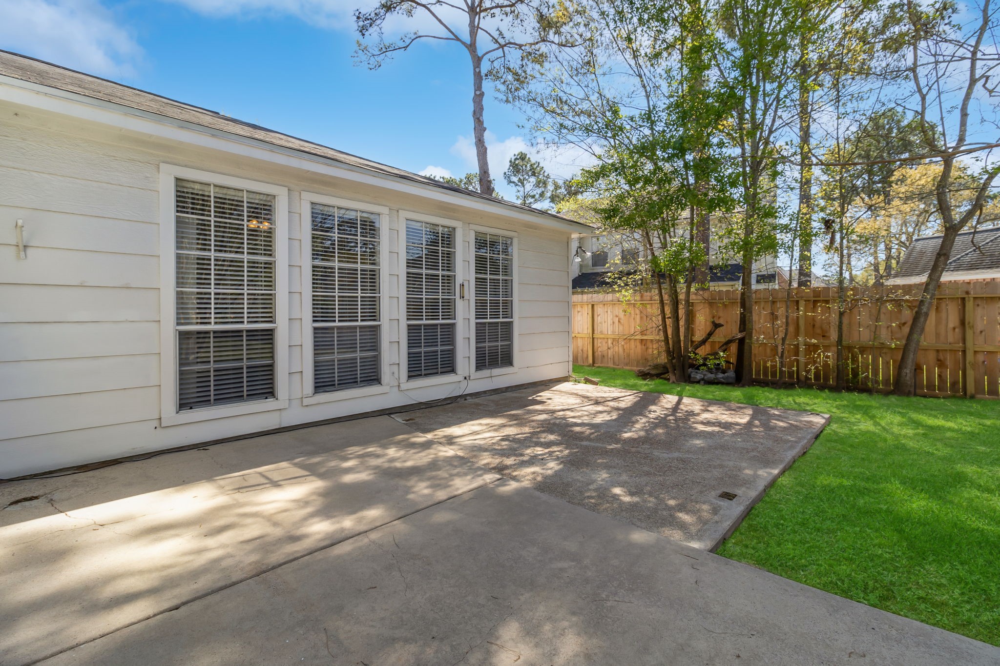 18106 Briden Oak Court Spring, TX 77379 - Photo 24 of 31 a view of a backyard with large trees