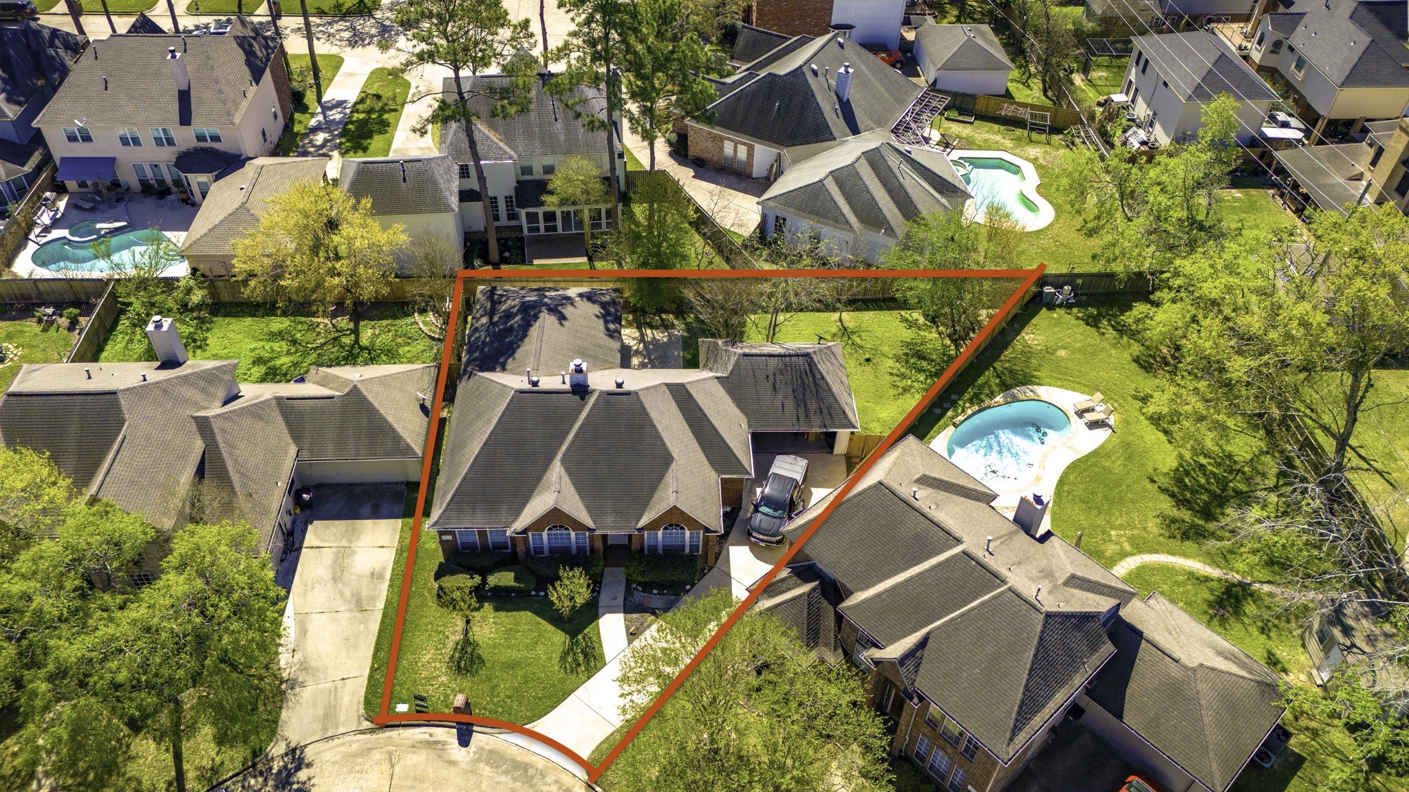 18106 Briden Oak Court Spring, TX 77379 - Photo 3 of 31 an aerial view of a house with a garden and swimming pool