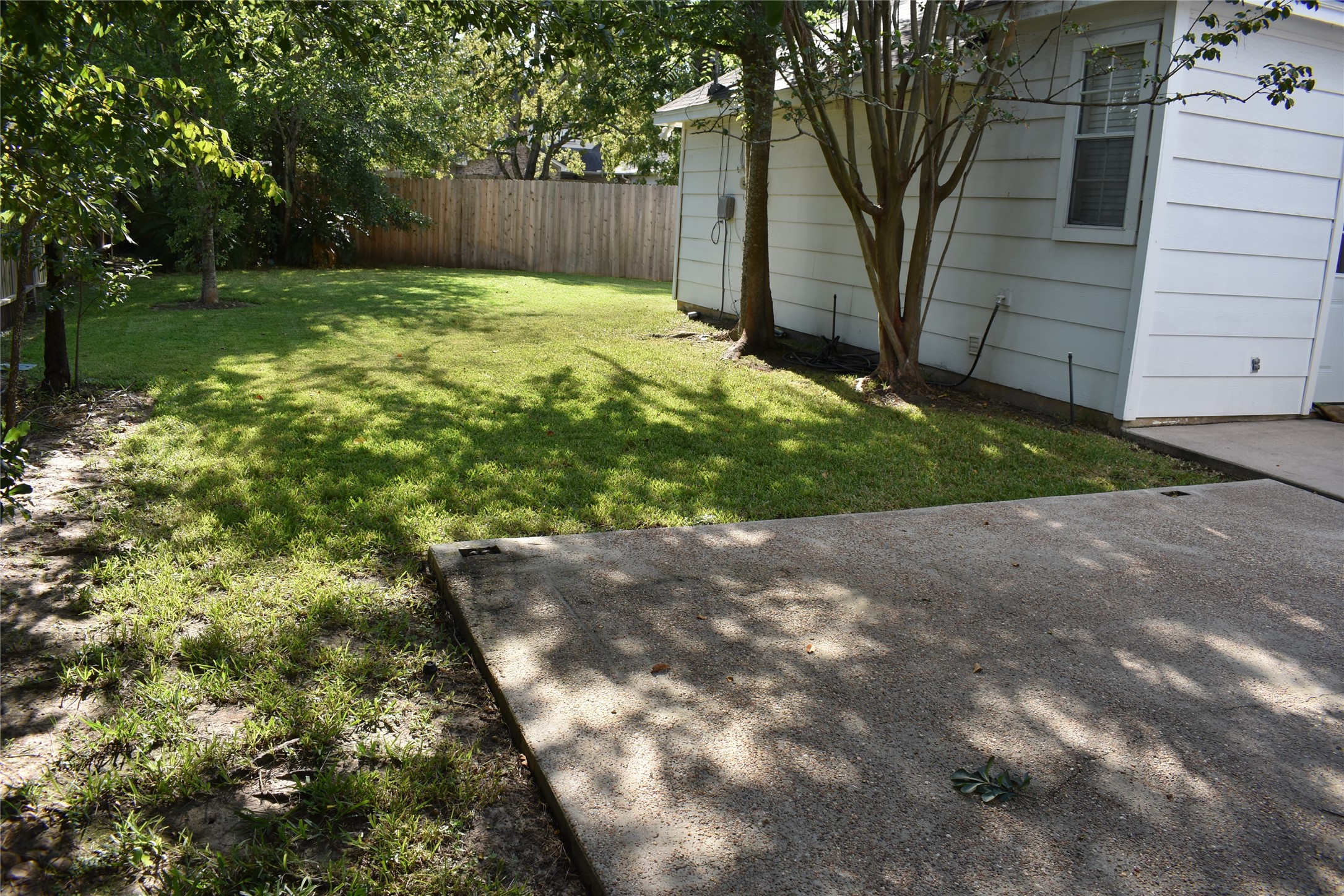 18106 Briden Oak Court Spring, TX 77379 - Photo 31 of 31 a view of a backyard with large tree