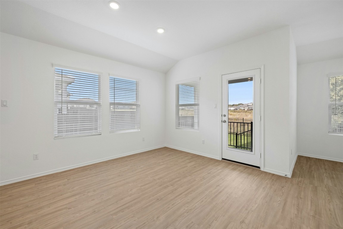 1804 Boggy Crk Rnch Road Georgetown, TX 78628 - Photo 12 of 28 an empty room with wooden floor and windows