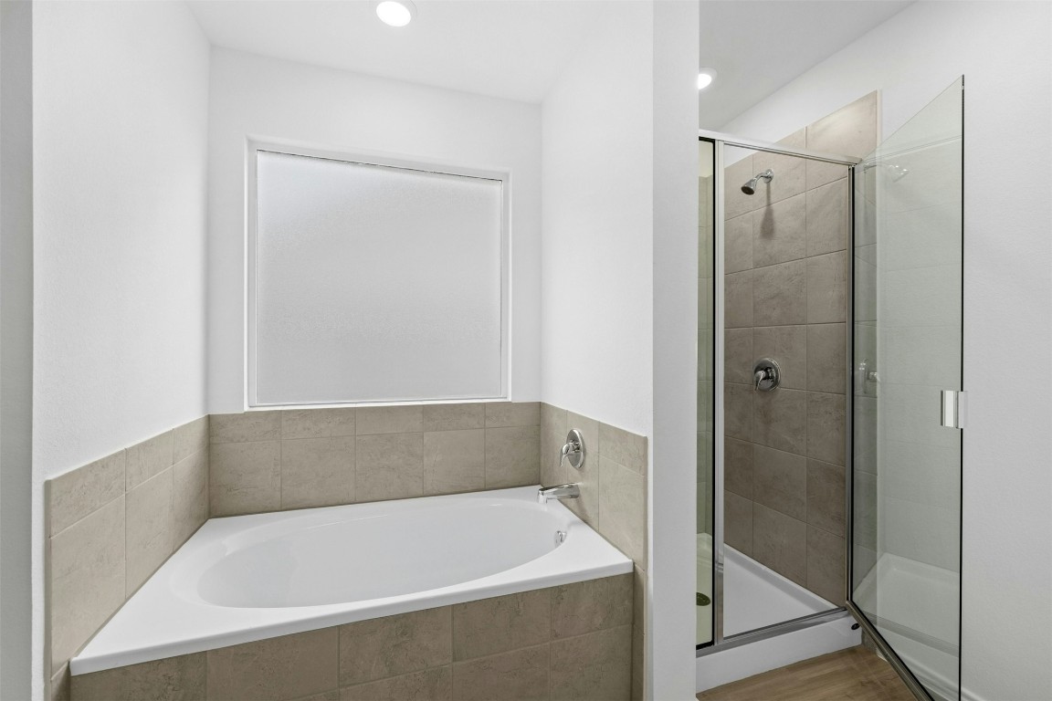 1804 Boggy Crk Rnch Road Georgetown, TX 78628 - Photo 15 of 28 a bathroom with a bath tub and shower