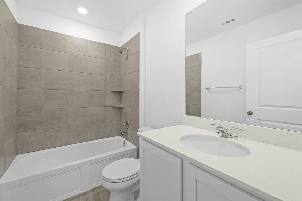 1804 Boggy Crk Rnch Road Georgetown, TX 78628 - Photo 24 of 28 a bathroom with a sink a toilet and a bathtub