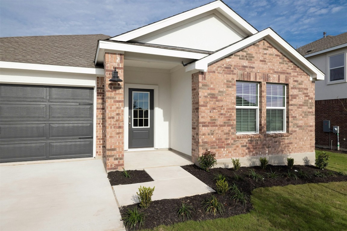 1804 Boggy Crk Rnch Road Georgetown, TX 78628 - Photo 3 of 28 a front view of a house with a yard