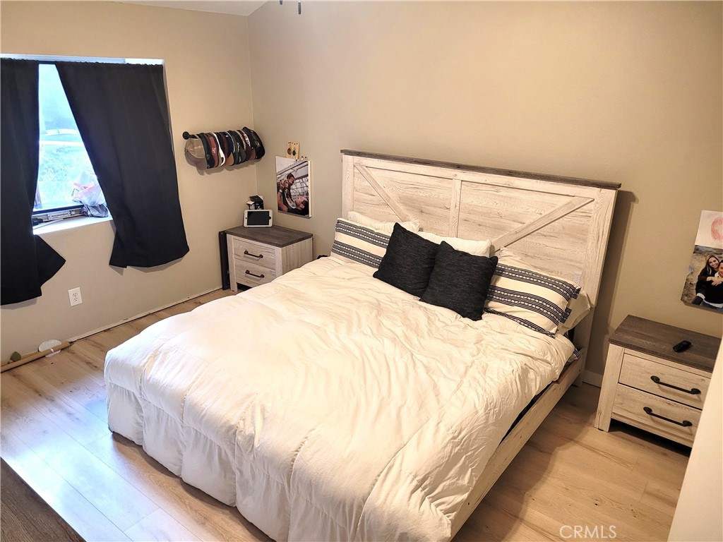 28162 Sloan Canyon Road, Unit A Castaic, CA 91384 - Photo 11 of 30 a large bed sitting in a bedroom next to a window