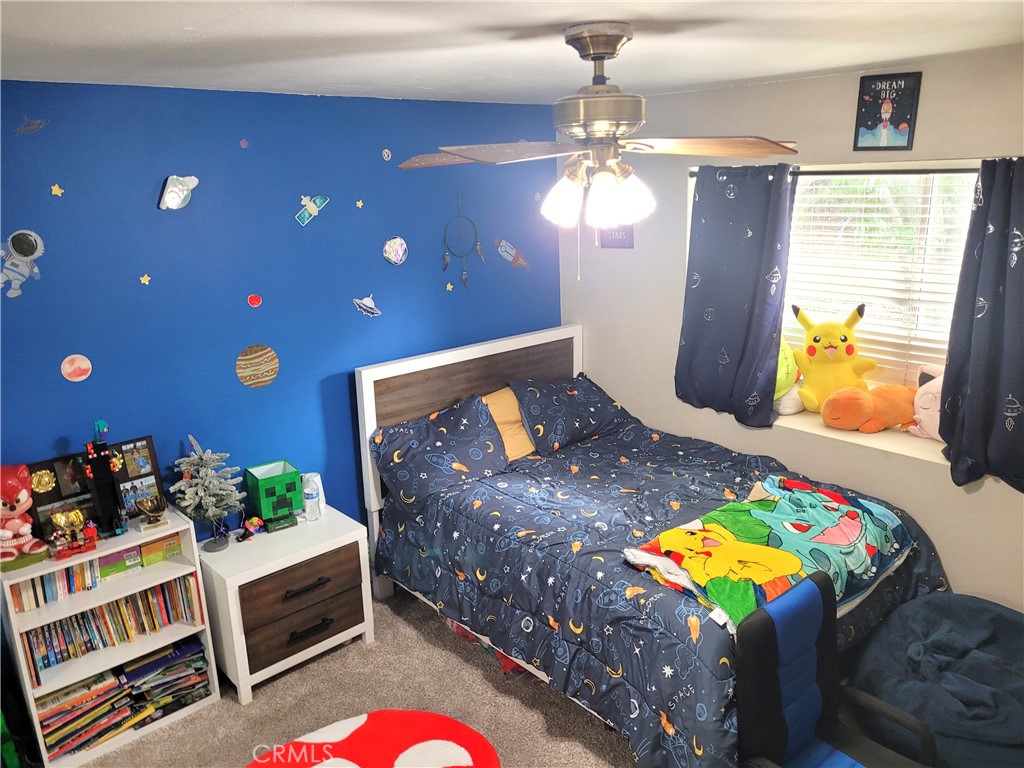 28162 Sloan Canyon Road, Unit A Castaic, CA 91384 - Photo 16 of 30 a bedroom with a bed and a dresser in it