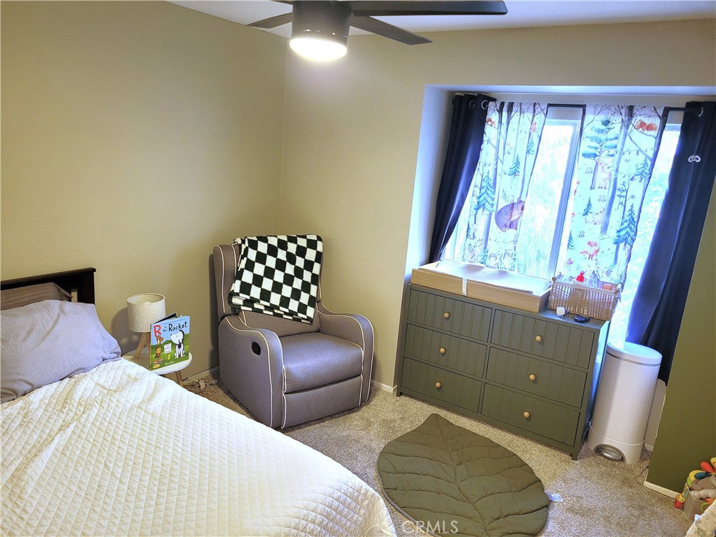 28162 Sloan Canyon Road, Unit A Castaic, CA 91384 - Photo 17 of 30 a bedroom with a bed and a window