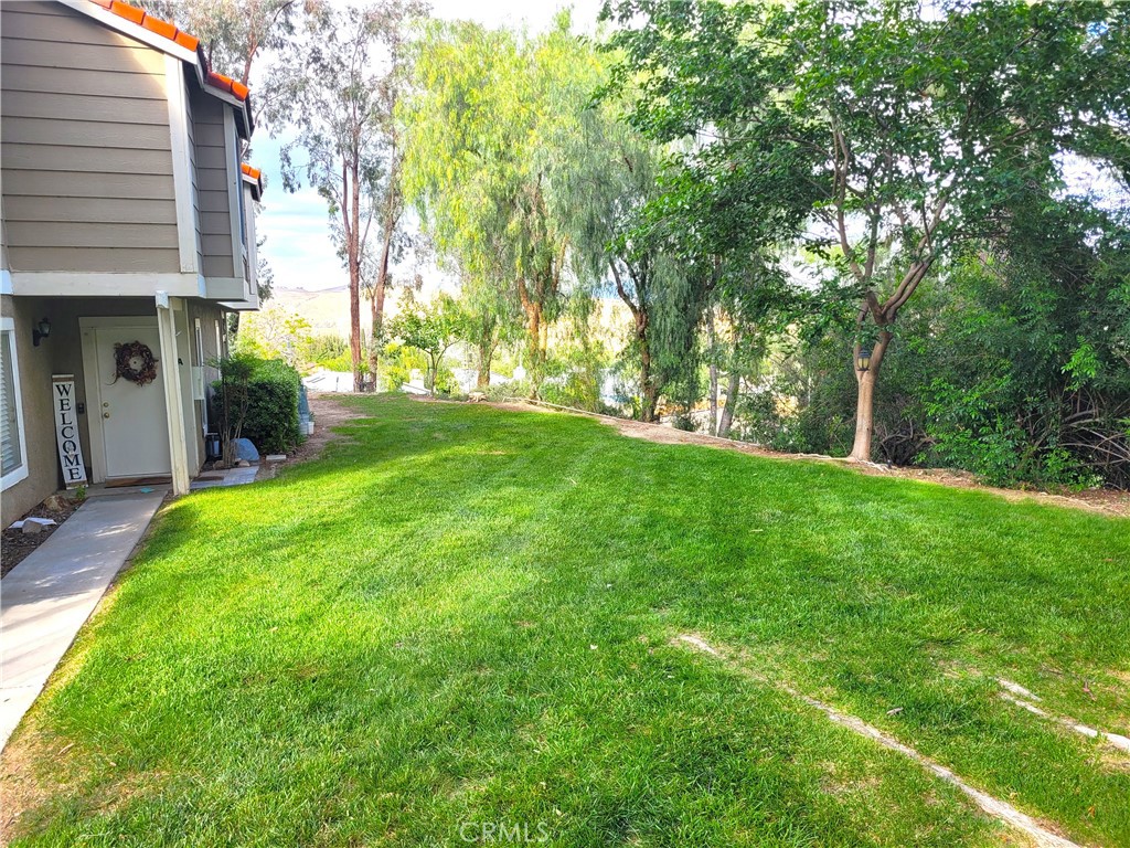 28162 Sloan Canyon Road, Unit A Castaic, CA 91384 - Photo 23 of 30 a view of a house with a backyard