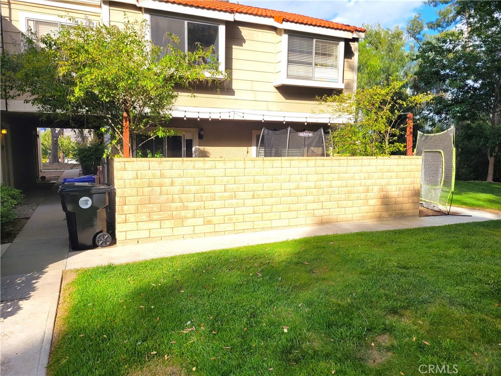 28162 Sloan Canyon Road, Unit A Castaic, CA 91384 - Photo 24 of 30 a view of a house with a yard