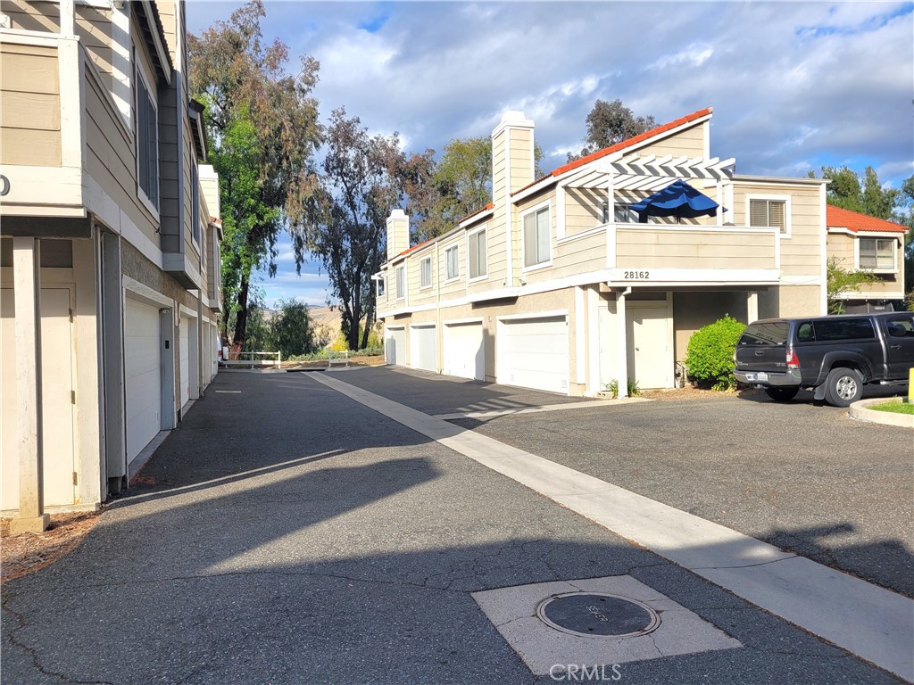 28162 Sloan Canyon Road, Unit A Castaic, CA 91384 - Photo 27 of 30 a view of a street with cars