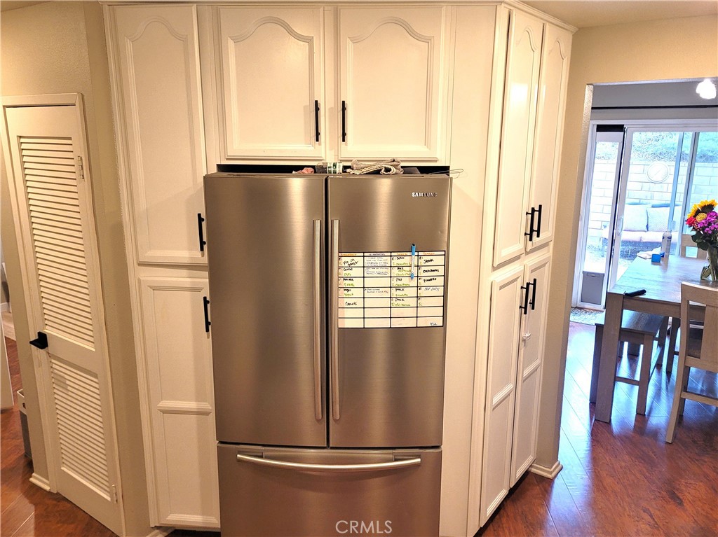 28162 Sloan Canyon Road, Unit A Castaic, CA 91384 - Photo 8 of 30 a view of a refrigerator in kitchen and wooden floor