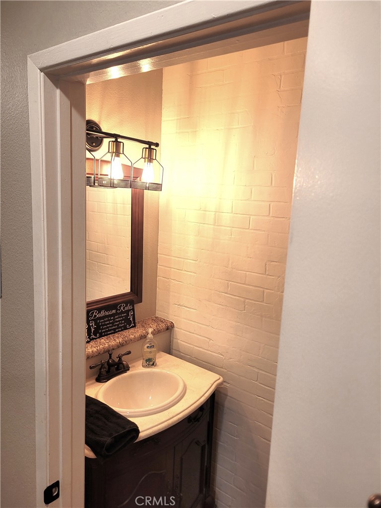 28162 Sloan Canyon Road, Unit A Castaic, CA 91384 - Photo 9 of 30 a bathroom with a sink and a mirror