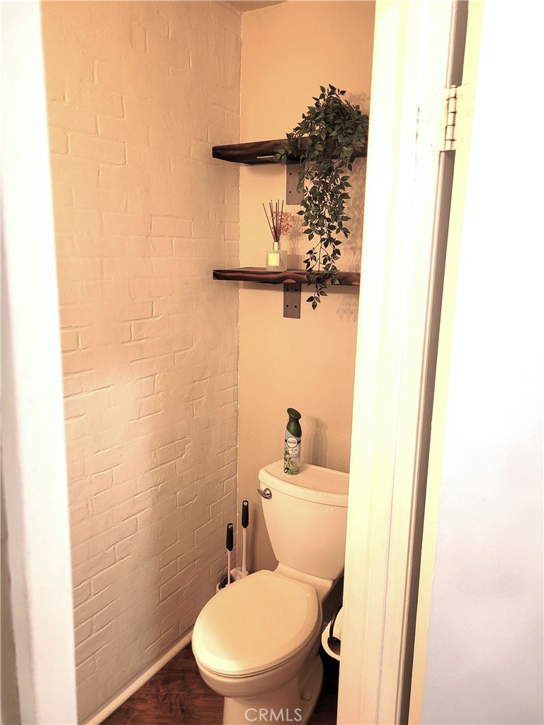 28162 Sloan Canyon Road, Unit A Castaic, CA 91384 - Photo 10 of 30 a white toilet sitting next to a small sink