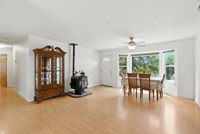 a view of a livingroom with furniture and window