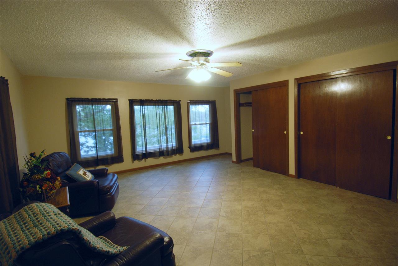 6410 Park Ridge Road Loves Park, IL 61111 - Photo 8 of 20 a living room with furniture and large windows