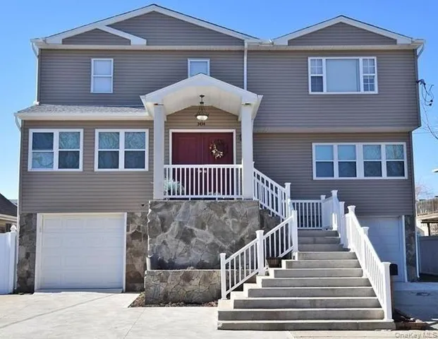 a front view of a house with stairs